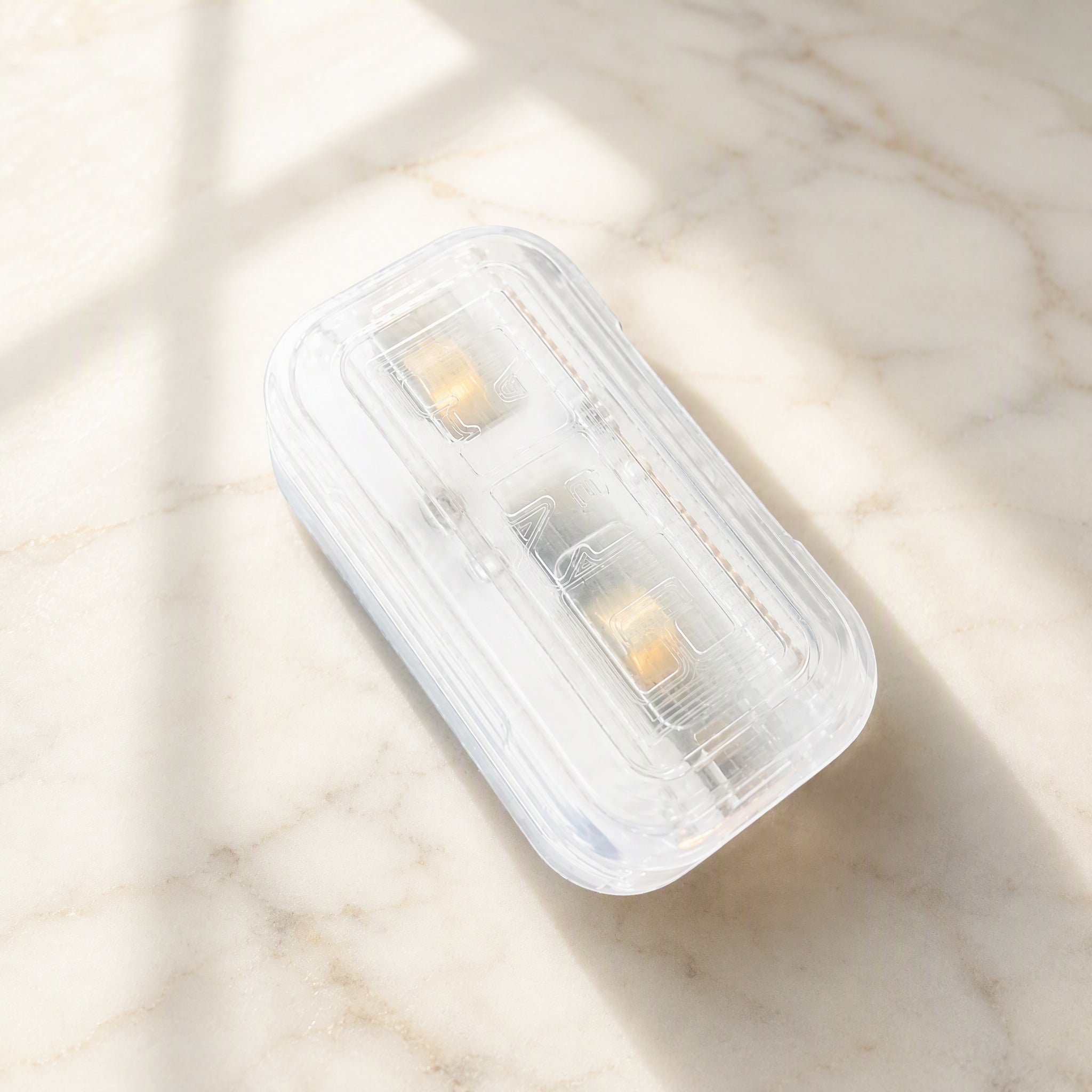 Transparent fidget slider scene on marble surface